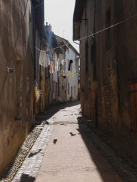 Narrow alley amidst buildings in town