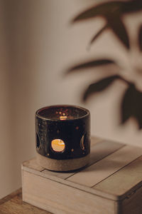 Close-up of tea light candles on table