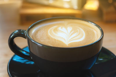 Close-up of cappuccino on table