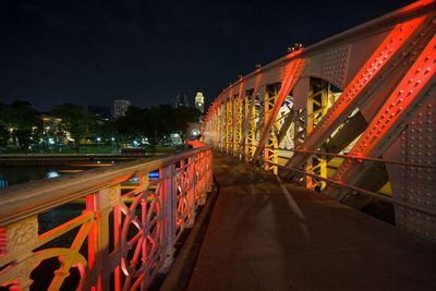 Illuminated bridge at night