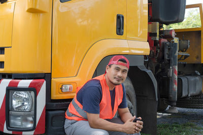 Full length of a young man sitting in car