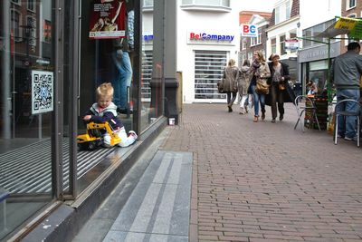 Rear view of woman walking in city