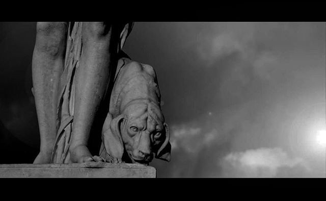 statue, sculpture, art and craft, art, human representation, low angle view, transfer print, sky, creativity, auto post production filter, animal representation, cloud - sky, indoors, day, cloudy, one animal, cloud, animal themes