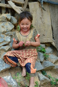 Portrait of smiling girl holding horse