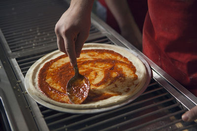 Close-up of person preparing food