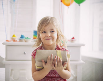 Portrait of smiling girl at home