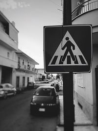 Close-up of road sign on street