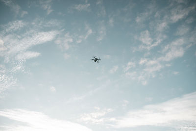 Low angle view of airplane in sky