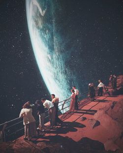 Digital composite image of people and woman at night