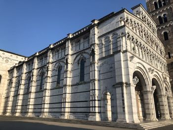 Low angle view of building against clear blue sky