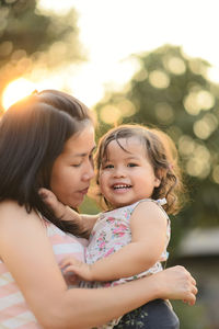 Close-up of happy mother and daughter
