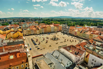 High angle view of buildings and town square against sky