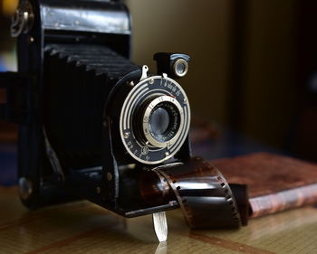 Close-up of camera on table