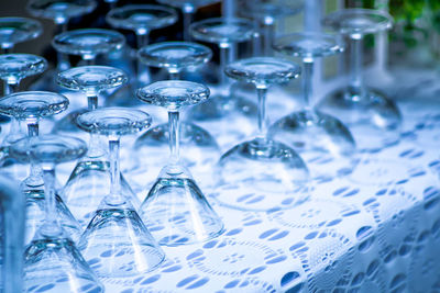 Close-up of wine glasses on table