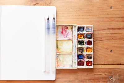 High angle view of paintbrushes on table