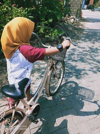 Rear view of boy riding bicycle