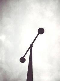 Low angle view of street light against sky