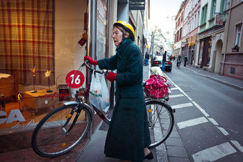 WOMAN WALKING ON CITY STREET