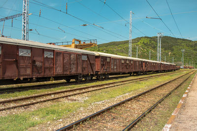 Train on railroad track against sky