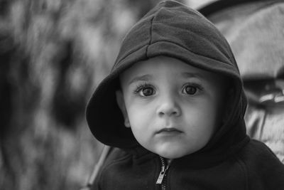 Black and white portrait of a toddler in a hoodie