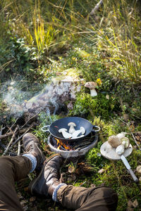 High angle view of people on barbecue grill