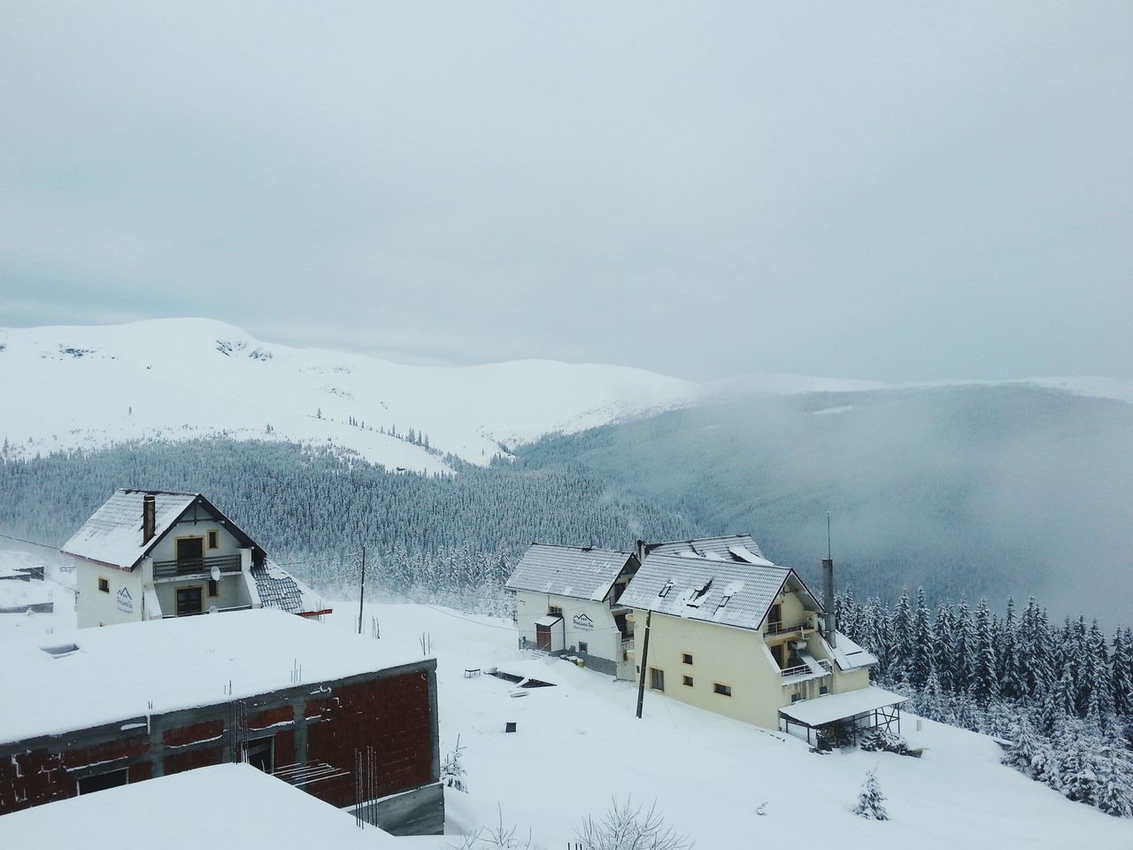 winter, snow, cold temperature, weather, season, building exterior, covering, architecture, built structure, landscape, mountain, house, nature, sky, scenics, beauty in nature, tranquil scene, fog, frozen, tranquility