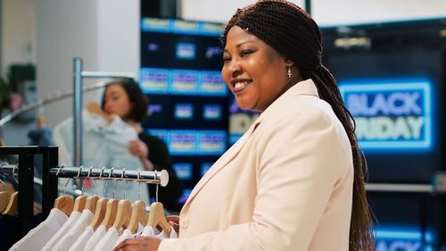 Portrait of young woman standing in store