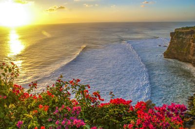 Scenic view of sea against sky at sunset