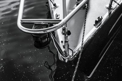 Close-up of reflection of cars on water