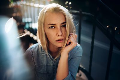 Close-up of young woman using mobile phone