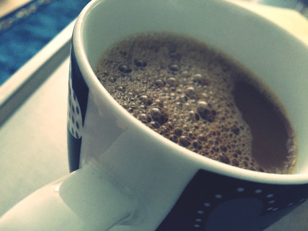 food and drink, close-up, still life, indoors, high angle view, spoon, coffee cup, drink, no people, part of, cup, cropped, refreshment, day, table, freshness, directly above, coffee - drink, coffee, transportation