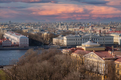 High angle view of river amidst buildings against sky