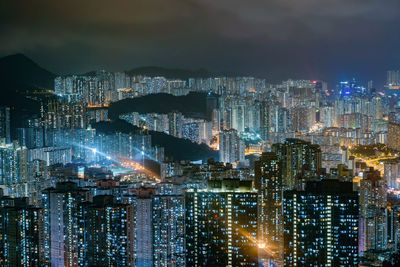 High angle view of illuminated city buildings at night