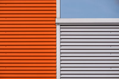 Close-up of colorful corrugates iron against clear sky