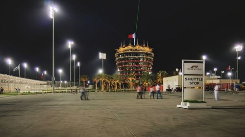 Illuminated city buildings at night