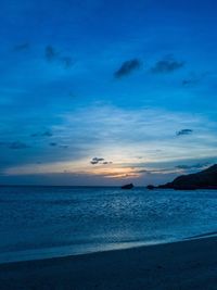 Scenic view of sea against blue sky