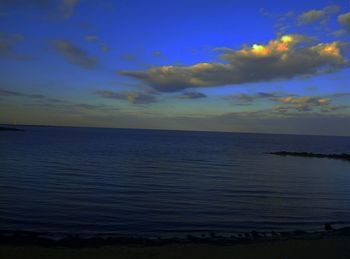 Scenic view of sea against sky at sunset