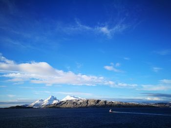 Scenic view of sea against blue sky