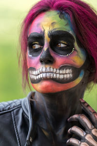 Close-up of woman with face paint