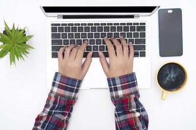 Directly above shot of woman using laptop