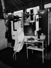 Close-up of clothes hanging on table at home