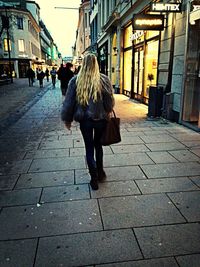 Woman walking on city street