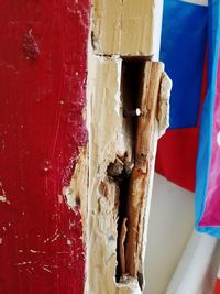 Close-up of old flag against white wall