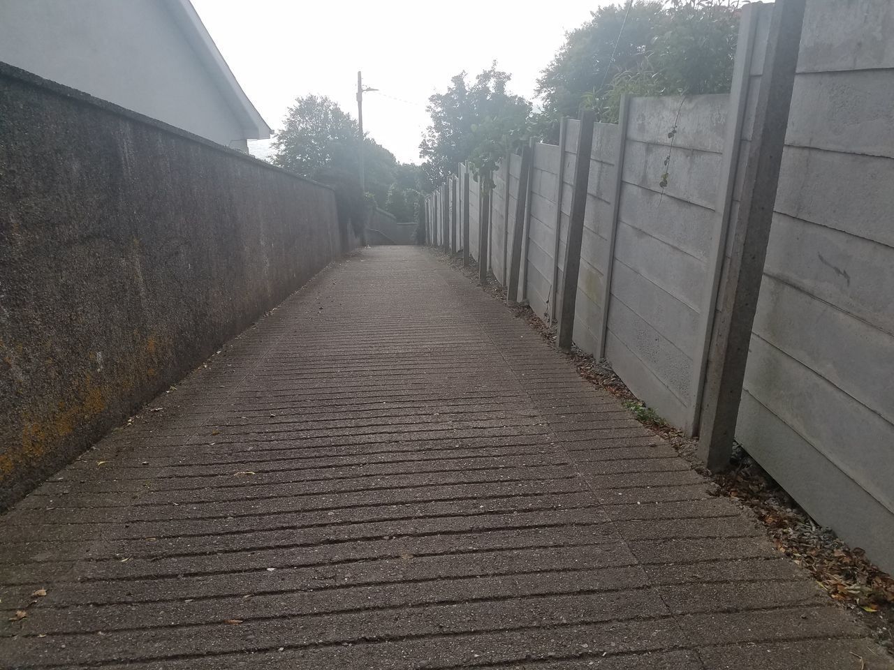 EMPTY ALLEY AMIDST BUILDINGS