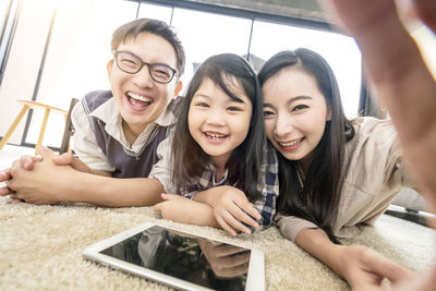 Portrait of a smiling young woman using mobile phone