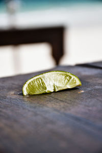 Close-up of lemon slice on table