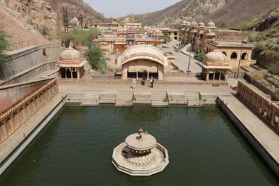 High angle view of lake by buildings