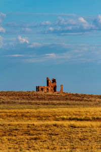 Built structure on land against sky