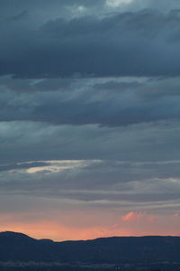 Low angle view of dramatic sky over sea