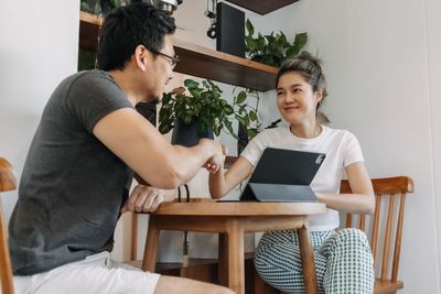 Young woman using laptop at home